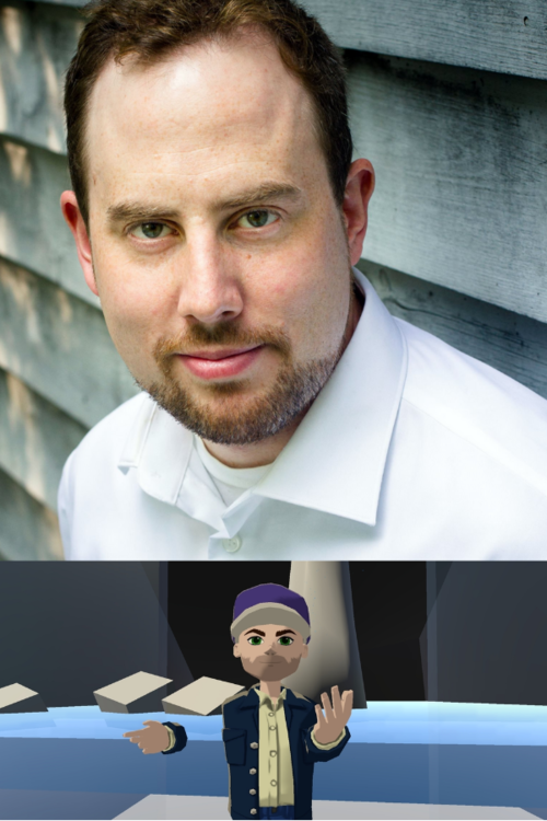 Liam Karry, a white man with reddish brown hair, is smiling, mouth closed, while looking at the camera. He is wearing a collared white dress shirt, and has a short beard with a few flecks of gray. He is standing in front of an exterior wall made out of weathered wood.